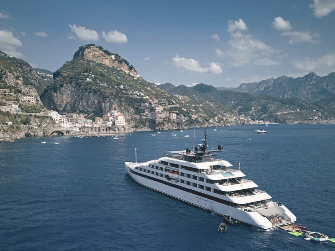 image of a super yacht near a coast