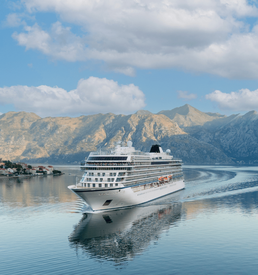 Cruise ship with mountain backdrop