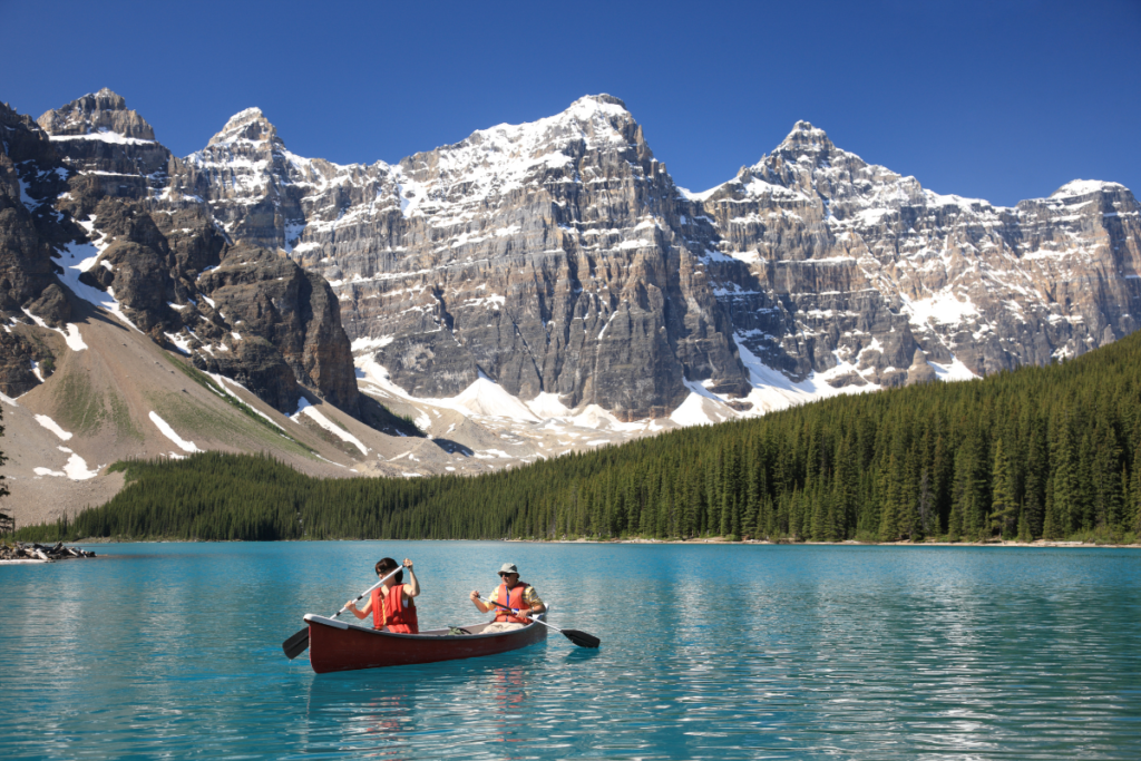 Couple kayaking in the Canadian Rockies 