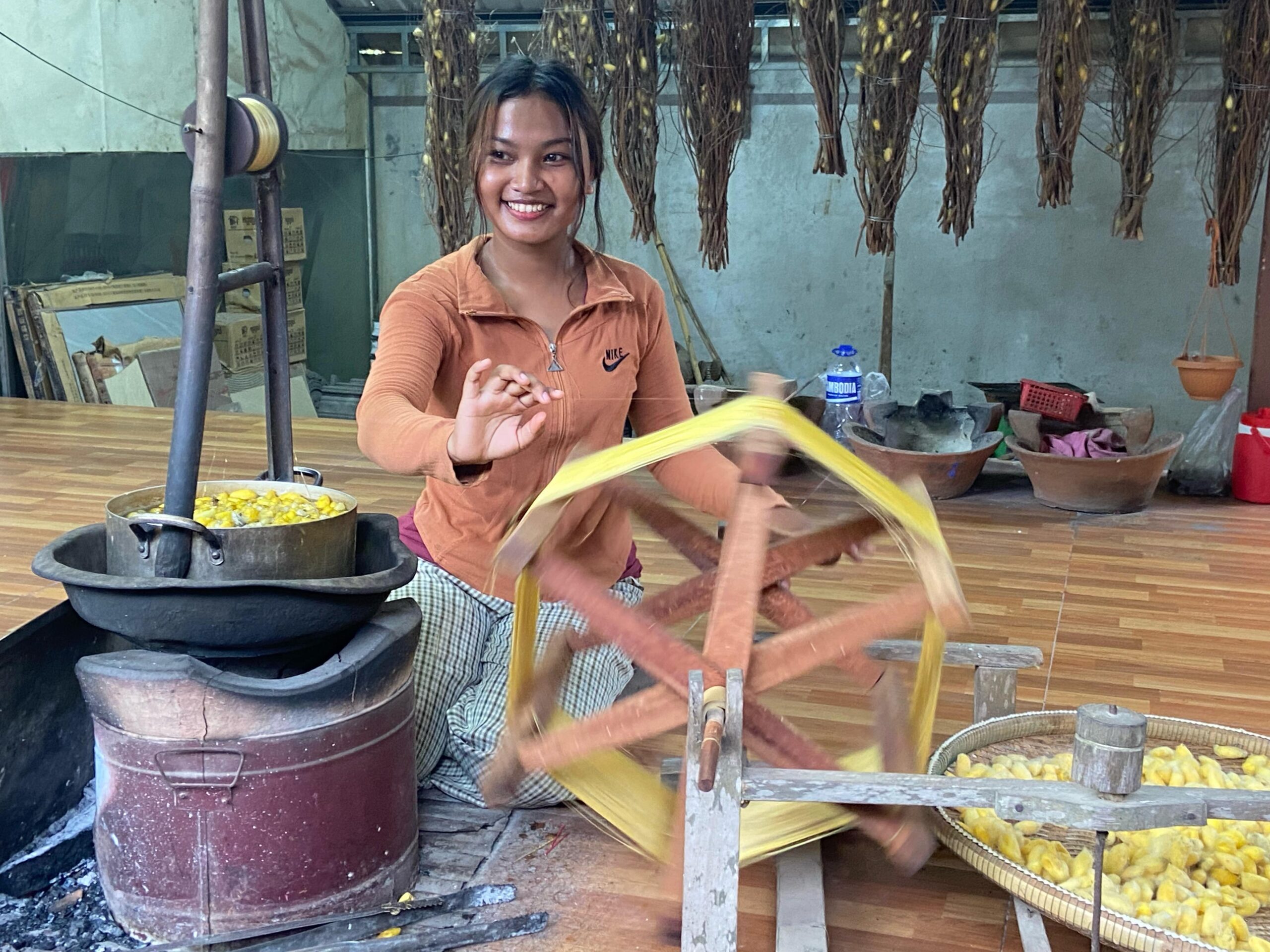 Woman weaving silk