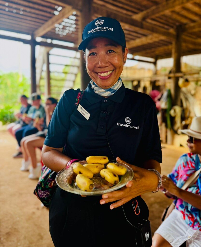 Woman in Cambodia holding a plate with food