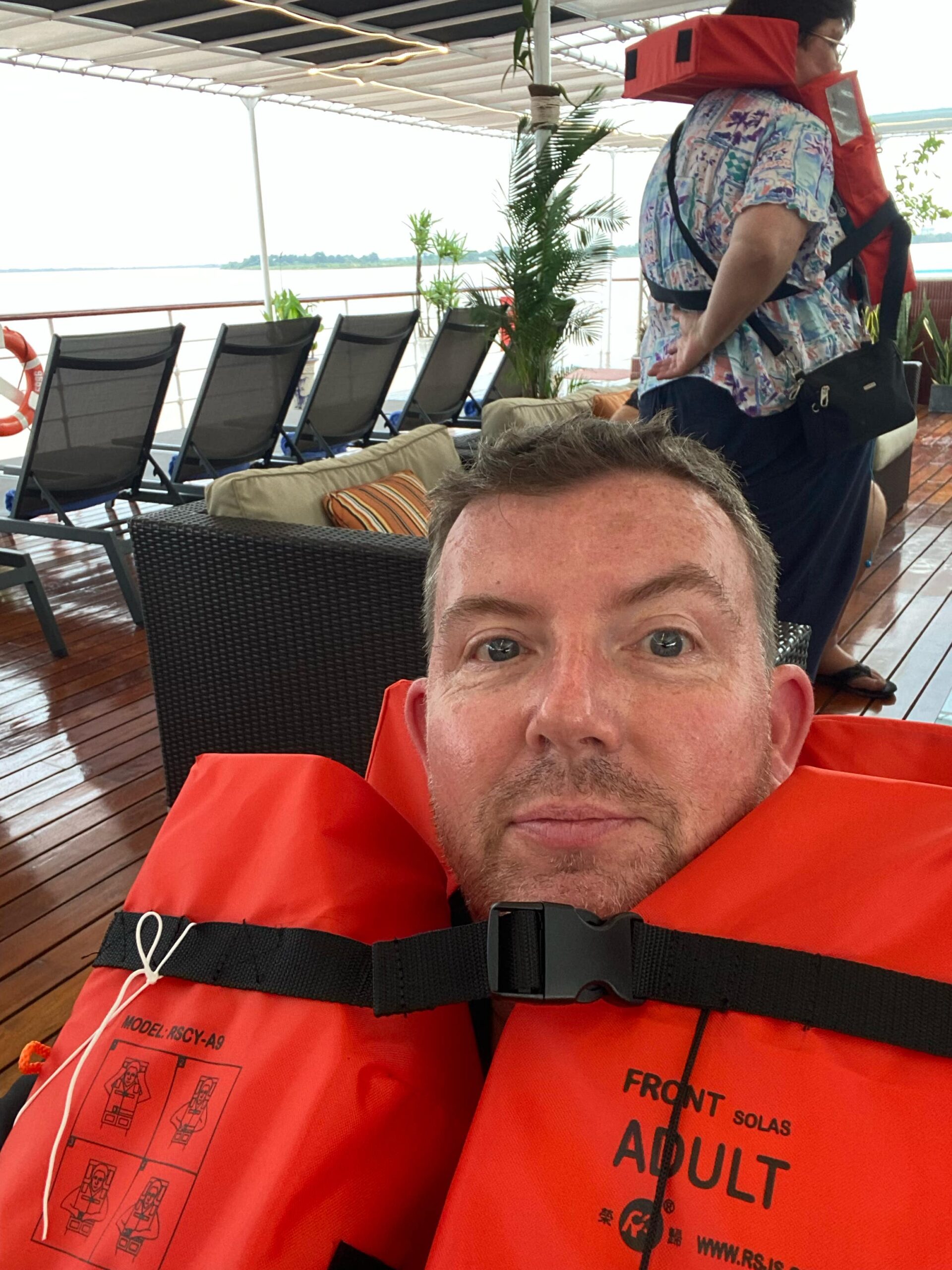Selfie of Lee in a vest