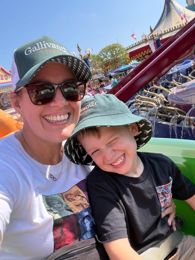 Brit with her son on a ride in Hong Kong Disneyland