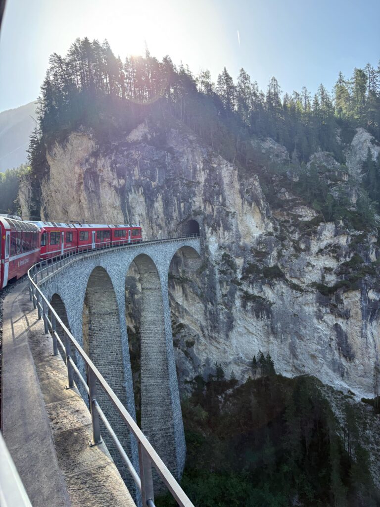 Train going into mountain in tunnel