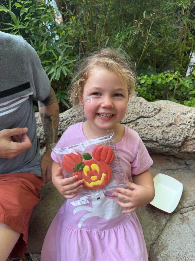 Lucy eating a Mickey Mouse Pumpkin candy treat