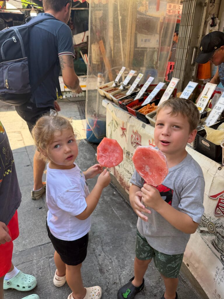 Brit's children eating food on a stick
