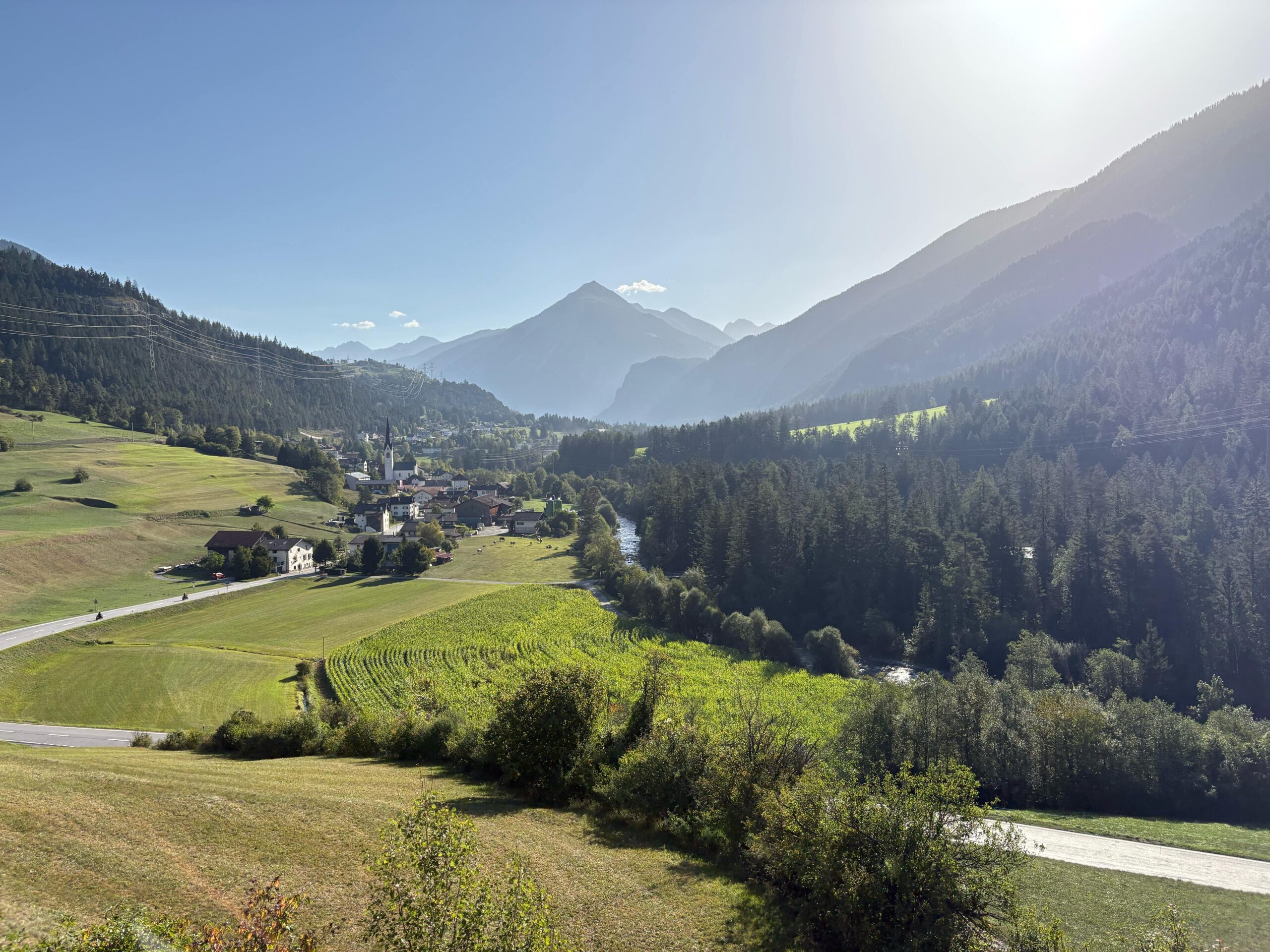 San Carlo village with a mountain in the background